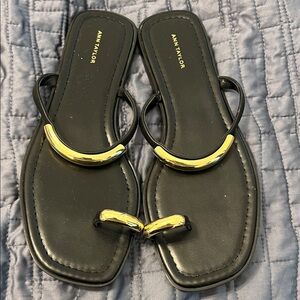 Elegant Black Sandals with Gold toe and ankle accents